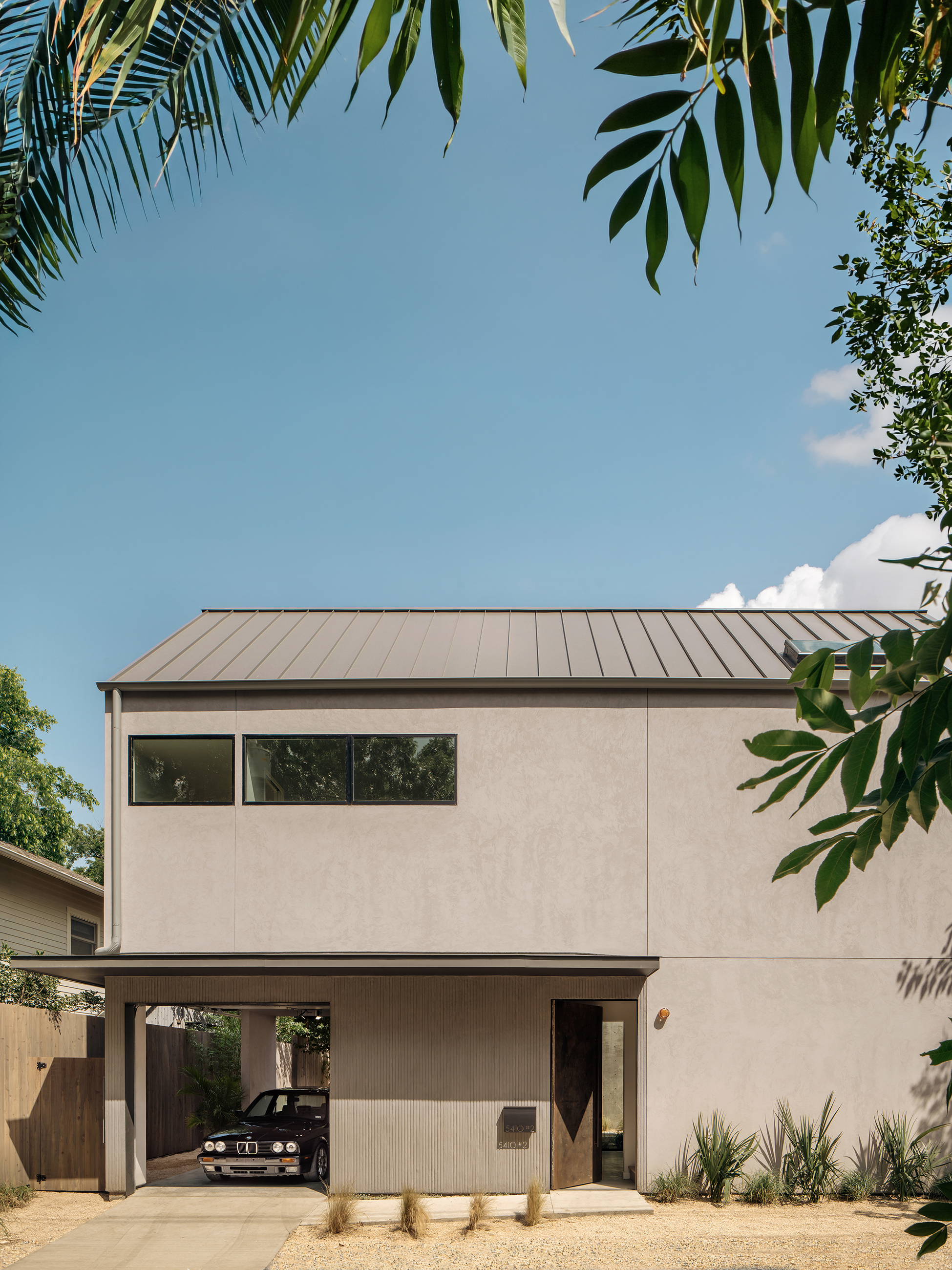 Side elevation, gabled black volume above concrete base